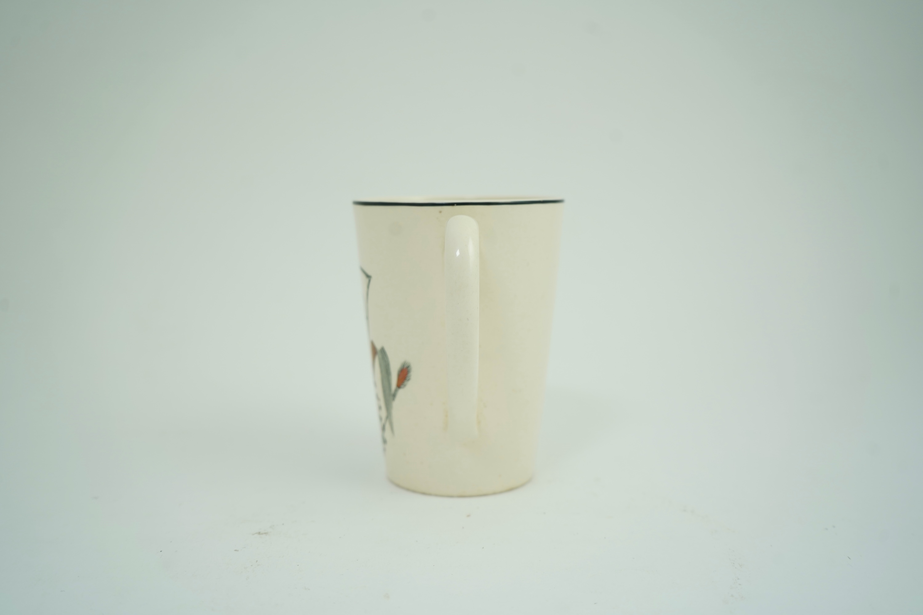 Eric Ravilious (1903-1942) for Wedgwood: A 'Garden Implements' lemonade mug